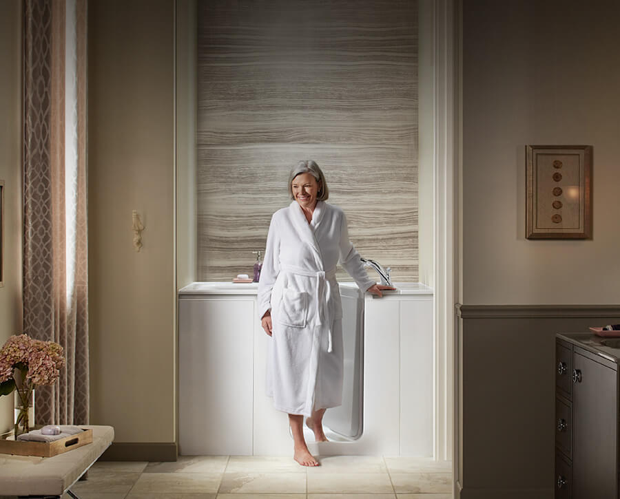 Elderly woman stepping in to walk-in tub