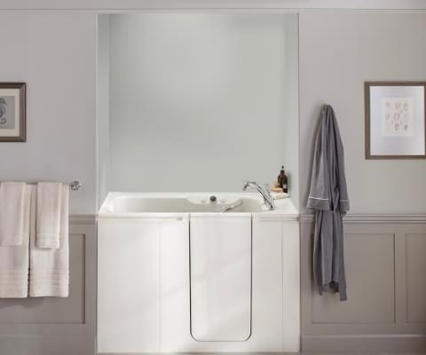 view of walk-in bath with ice grey wall surround